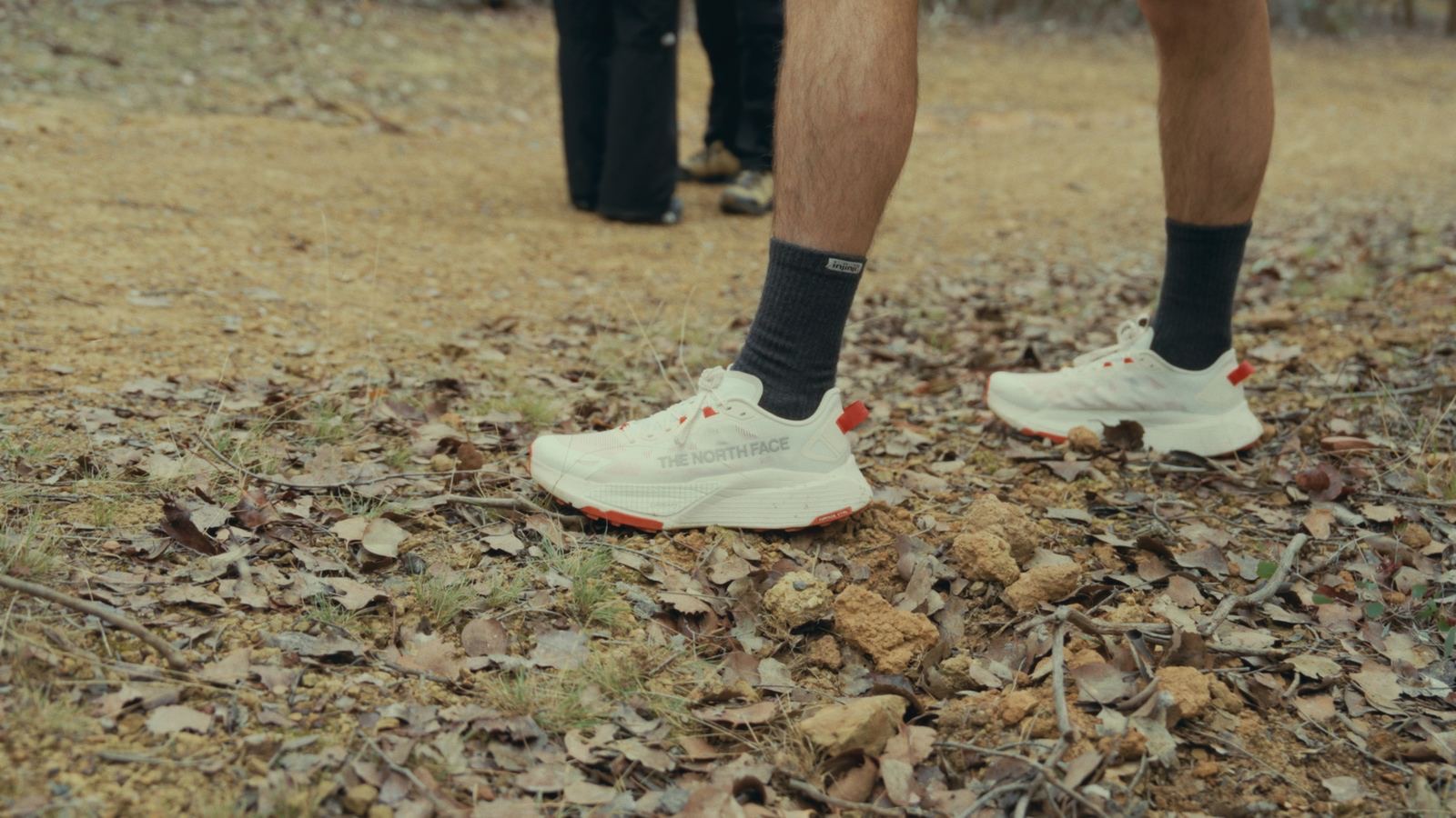 White trail shoes on dry gravel
